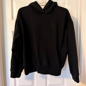 Black Target sweatshirt without front pocket. Fits cropped. Warm and soft.